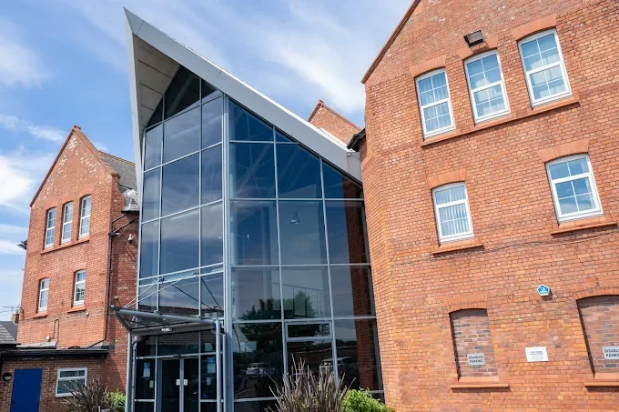 Hartlepool Enterprise Centre, Brougham Terrace, TS24 8EY Modern glass entrance to a brick building with a distinctive roofline.